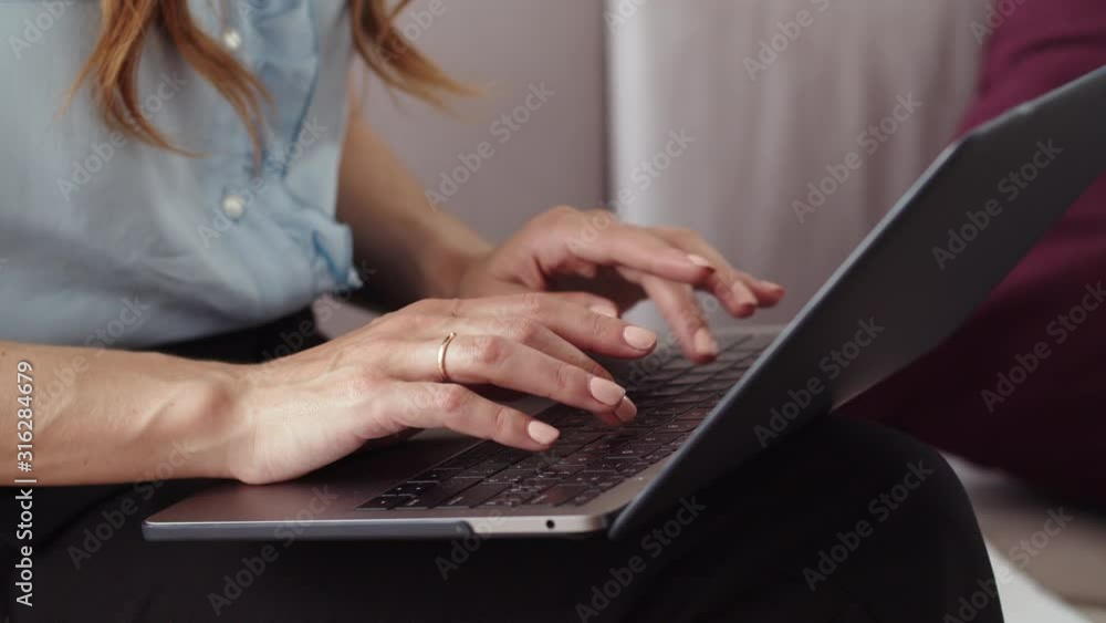 Female hands typing on laptop at remote office. Girl working on notebook. Female hands typing on laptop at remote office. Girl working on notebook.