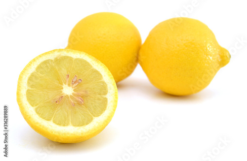Yellow ripe lemons isolated on white background
