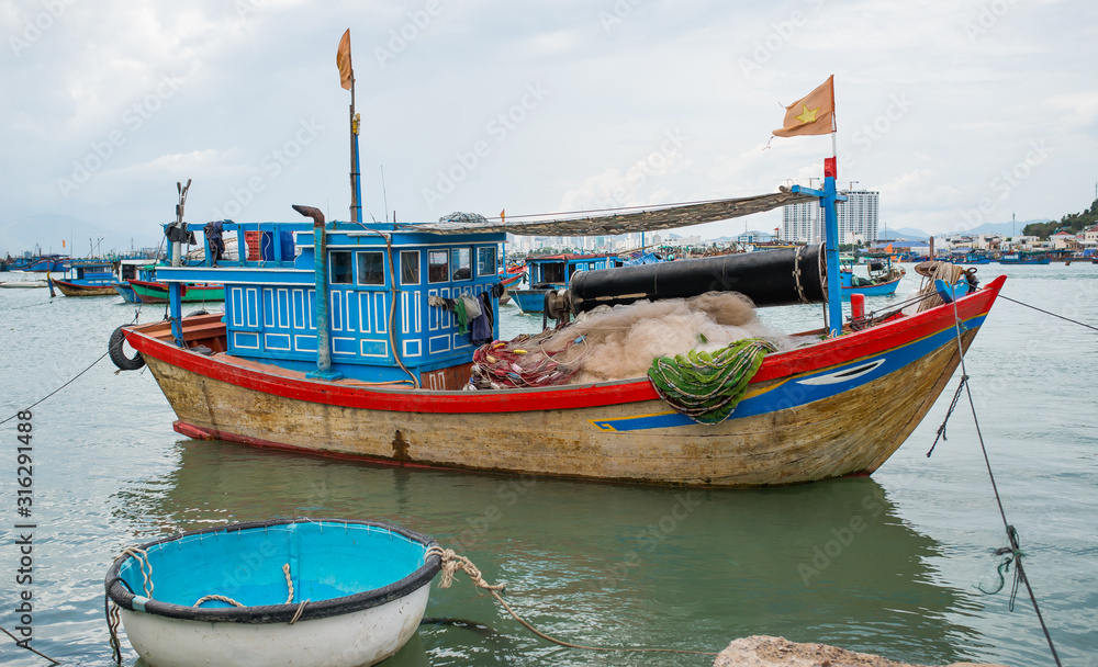 A typical Vietnamese wooden fishing boat used by local fishermen for fishing.