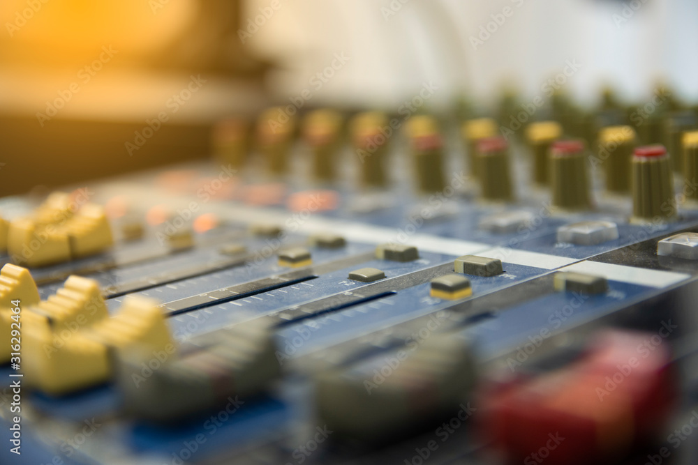 Close-up audio sound mixer console. Detail of a music mixer in studio DJ working. Close-up audio sound mixer console. Detail of a music mixer in studio DJ working.