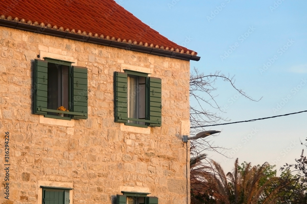 Colorful rustic window on a Mediterranean style building in Split, Croatia.