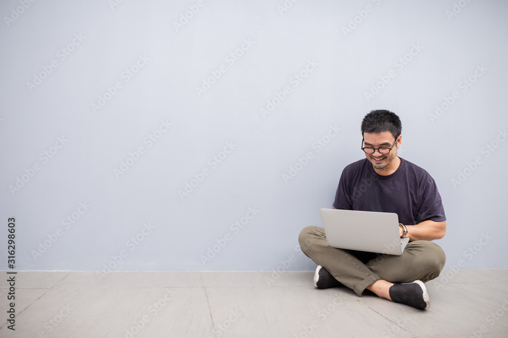 using computer.asian man hand typing message keyboard laptop shopping online.search information form internet while sitting on sofa.concept use technology device contact communication business using computer.asian man hand typing message keyboard laptop shopping online.search information form internet while sitting on sofa.concept use technology device contact communication business