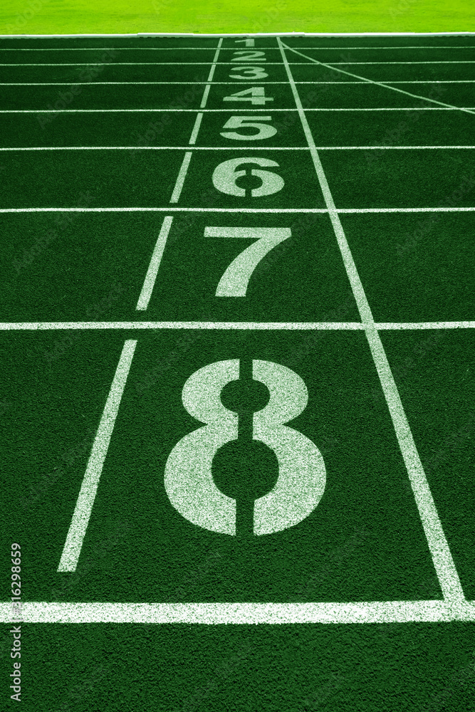 White lines of stadium and texture of running racetrack green rubber racetracks White lines of stadium and texture of running racetrack green rubber racetracks