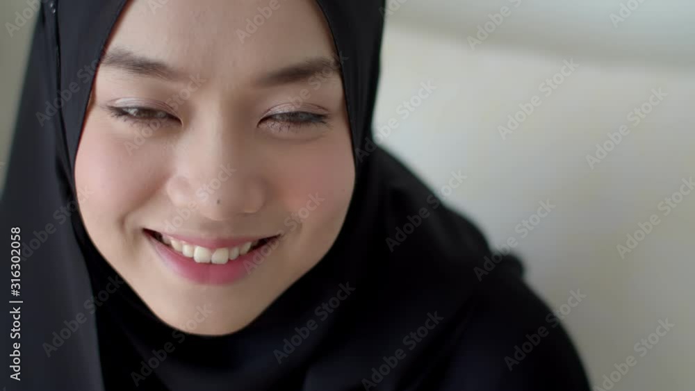 Headshot portrait of attractive teenage muslim female with beautiful smile Headshot portrait of attractive teenage muslim female with beautiful smile