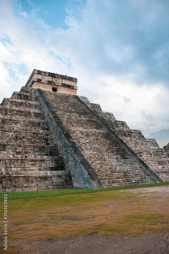 Antique pre hispanic Chichen Itza pyramid shot from behind