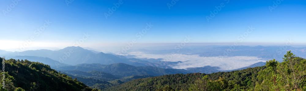 beautiful panoramic mountain and mist on blue sky background , at north thailand  inthanon national park , Chiang Mai province , panorama landscape Thailand