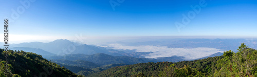 beautiful panoramic mountain and mist on blue sky background , at north thailand inthanon national park , Chiang Mai province , panorama landscape Thailand