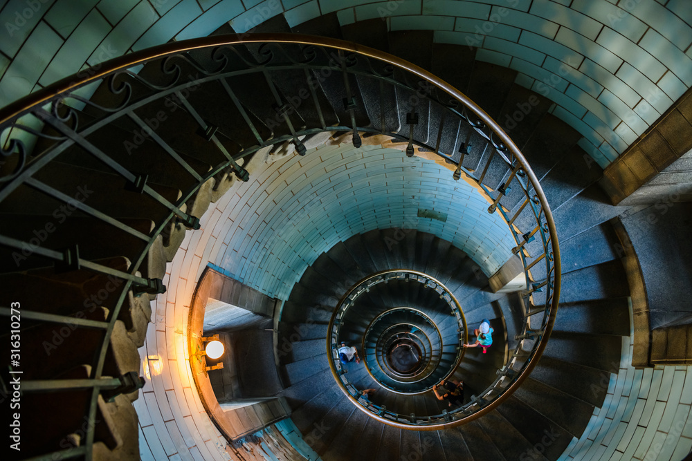 Beautiful spiral staircase to the top of Eckmuhl lighthouse, on the Penmarsh Peninsula.  Brittany. France