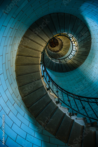 Beautiful spiral staircase to the top of Eckmuhl lighthouse, on the Penmarsh Peninsula. Brittany. France