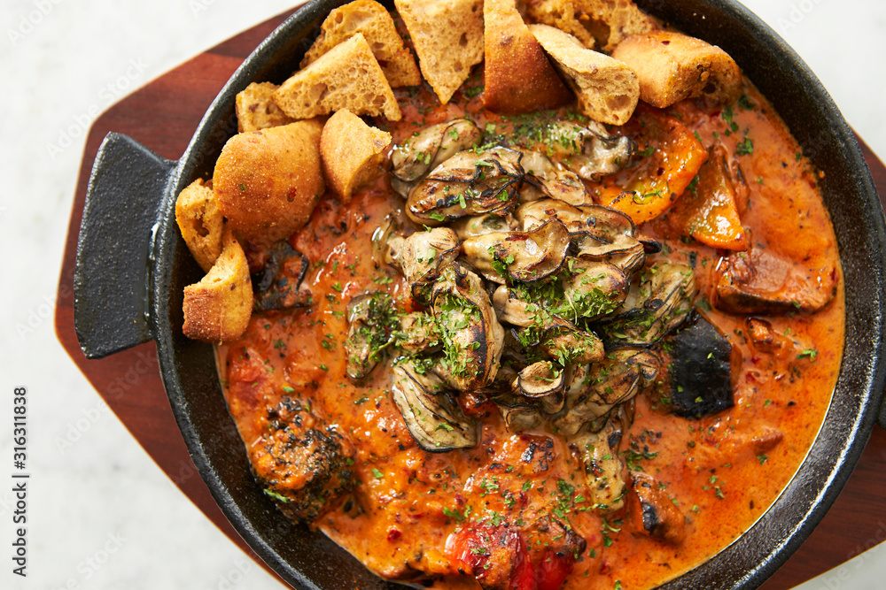 Grilled oyster with tomato sauce Grilled oyster with tomato sauce