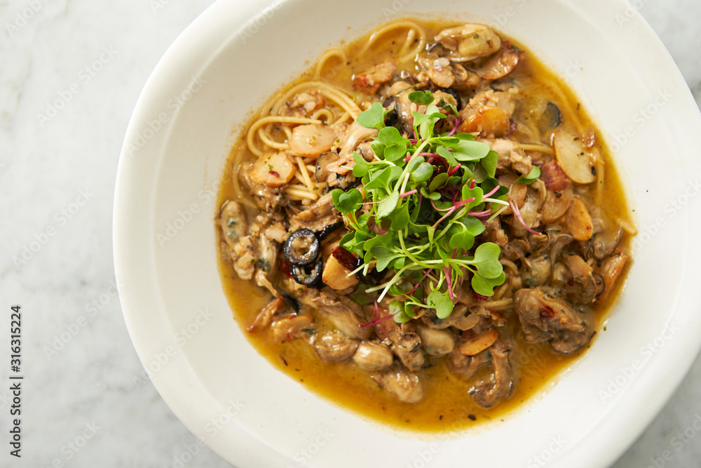 Oyster and garlic spaghetti studio shot Oyster and garlic spaghetti studio shot
