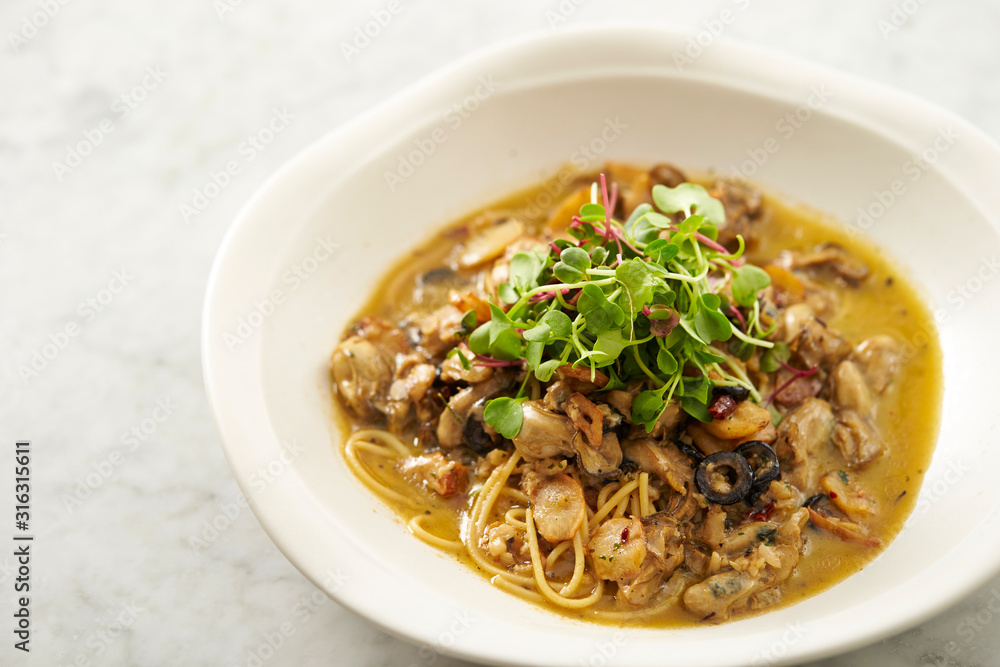Oyster and garlic spaghetti studio shot Oyster and garlic spaghetti studio shot