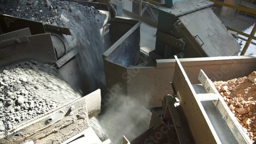 Cement factory. Conveyor with stones and gravel, tonnel. Modern technologies work at a cement plant. Technological work on the production of cement. Working atmosphere with copy space