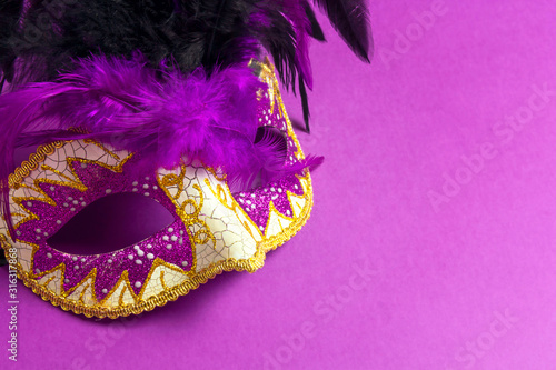 Fototapeta Naklejka Na Ścianę i Meble -  Carnivale mask on a purple background.