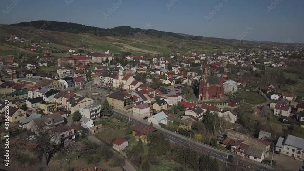 Panorama from a bird's eye view. Central Europe: The Polish town of Kolaczyce is located among the green hills. Temperate climate. Flight drones or quadrocopter. Panorama from a bird's eye view. Central Europe: The Polish town of Kolaczyce is located among the green hills. Temperate climate. Flight drones or quadrocopter.