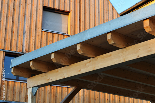 beams of a carport constructed with wood photo