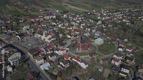 Panorama from a bird's eye view. Central Europe: The Polish town of Kolaczyce is located among the green hills. Temperate climate. Flight drones or quadrocopter. photo