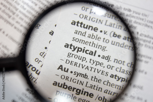 The word of phrase - atypical - in a dictionary. photo