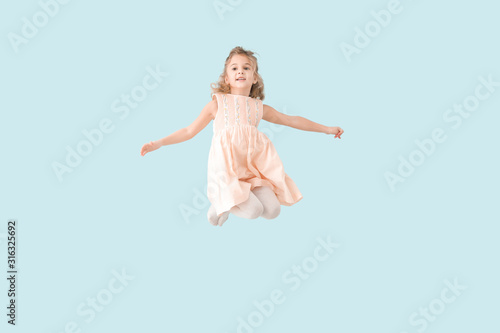 Jumping little girl on colo...