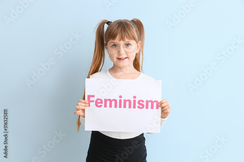 Little girl holding paper w...