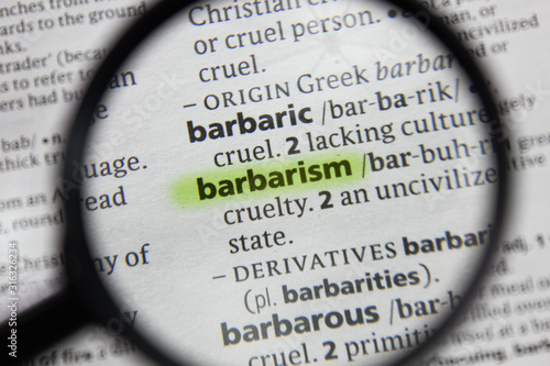The word or phrase barbarism in a dictionary. photo