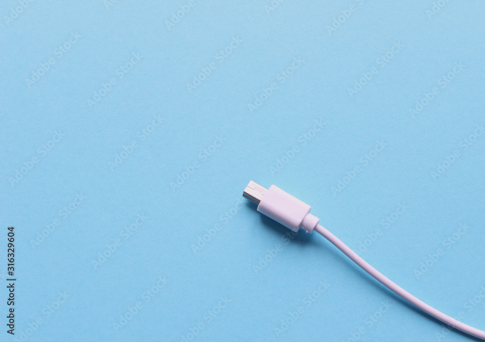 White wire usb mobile charging cable in white background. White wire usb mobile charging cable in white background.