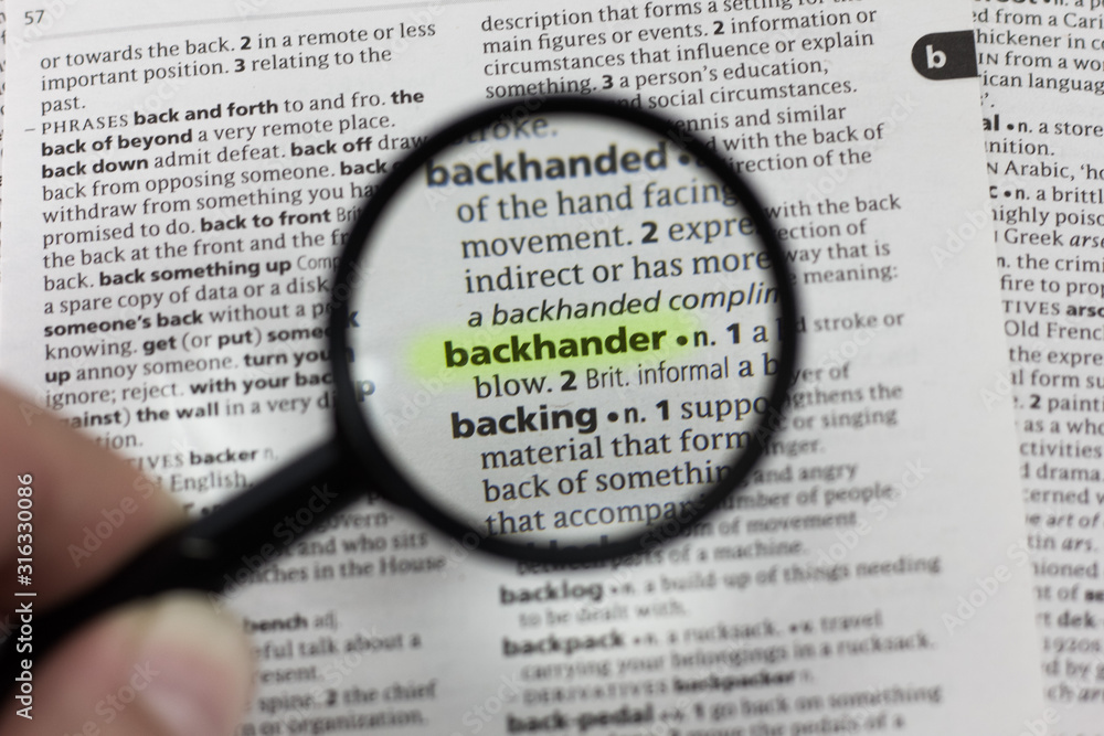 The word or phrase backhander in a dictionary. The word or phrase backhander in a dictionary.