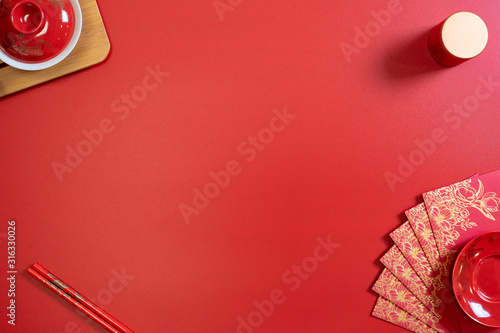 red background flatlay with chinese lunar new year elements
