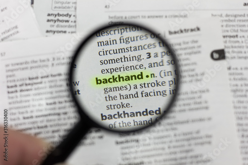 The word or phrase backhand in a dictionary.