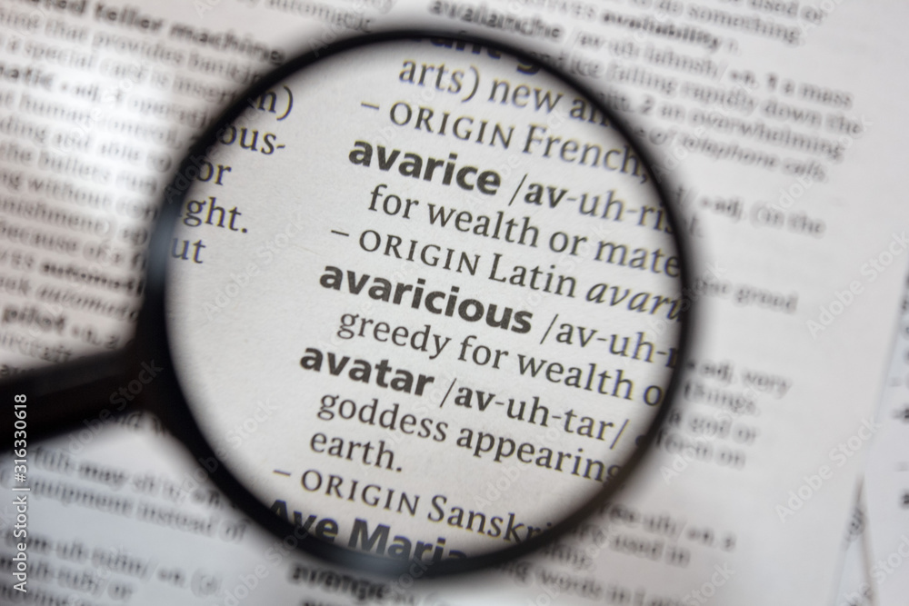 The word of phrase - avaricious - in a dictionary.