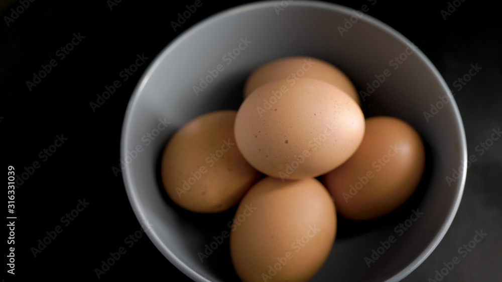 Ingredients and products in the kitchen. In a plate of chicken eggs. High-quality village foods for proper food. Ingredients and products in the kitchen. In a plate of chicken eggs. High-quality village foods for proper food.