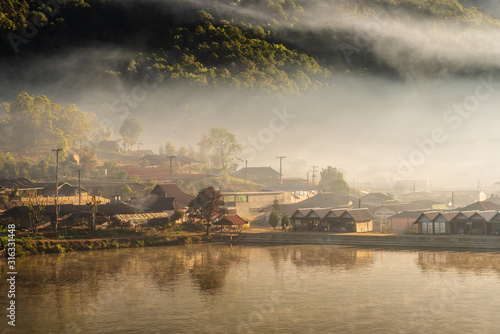 Morning mist and warm atmosphere surrounded by the village "Ban Rak Thai"