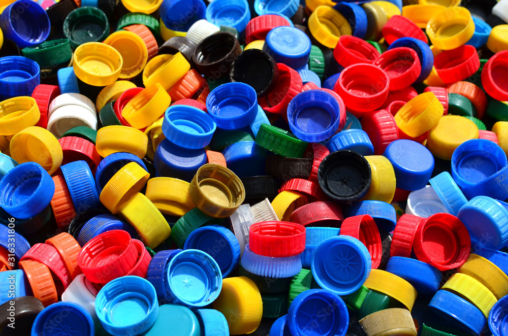 Plastic bottle caps background. Cap material is recyclable.Remove lids