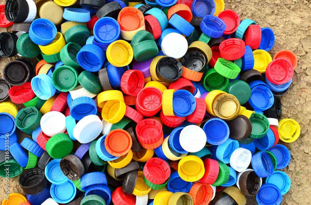 Plastic bottle caps background. Cap material is recyclable.Remove lids