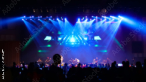 blurred picture of concert in hall at night 