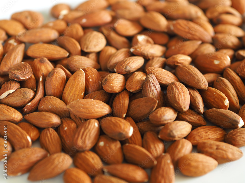 almond nuts on a white background. healthy foods almond nuts on a white background. healthy foods