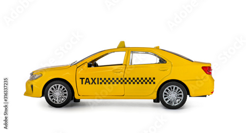 Fotografia Yellow taxi car model isolated on white