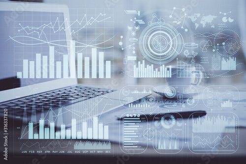 Forex graph hologram on table with computer background. Double exposure. Concept of financial markets.