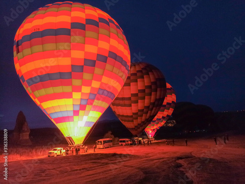 Colorful Hot Air Balloons preparing to fly early morning in winter in Cappadocia, Turkey
