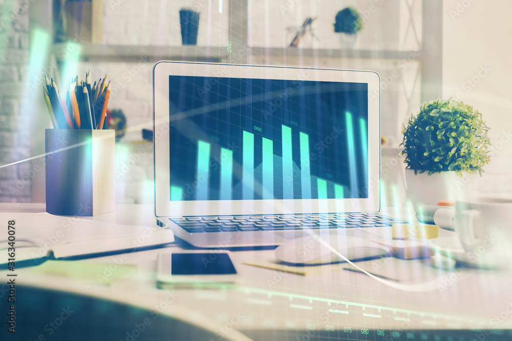 Forex Chart hologram on table with computer background. Double exposure. Concept of financial markets. Forex Chart hologram on table with computer background. Double exposure. Concept of financial markets.