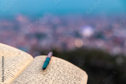 A journal notebook placed outdoors in open. selective focus.