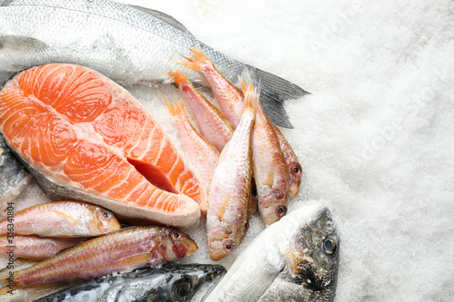Konstfotografi Fresh fish and seafood on ice, flat lay