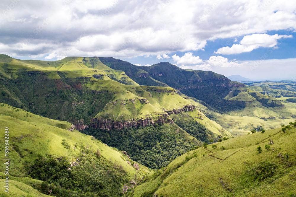 Panoramic view over steep and green mountains, Giants Castle Game Reserve, Drakensberg, South Africa