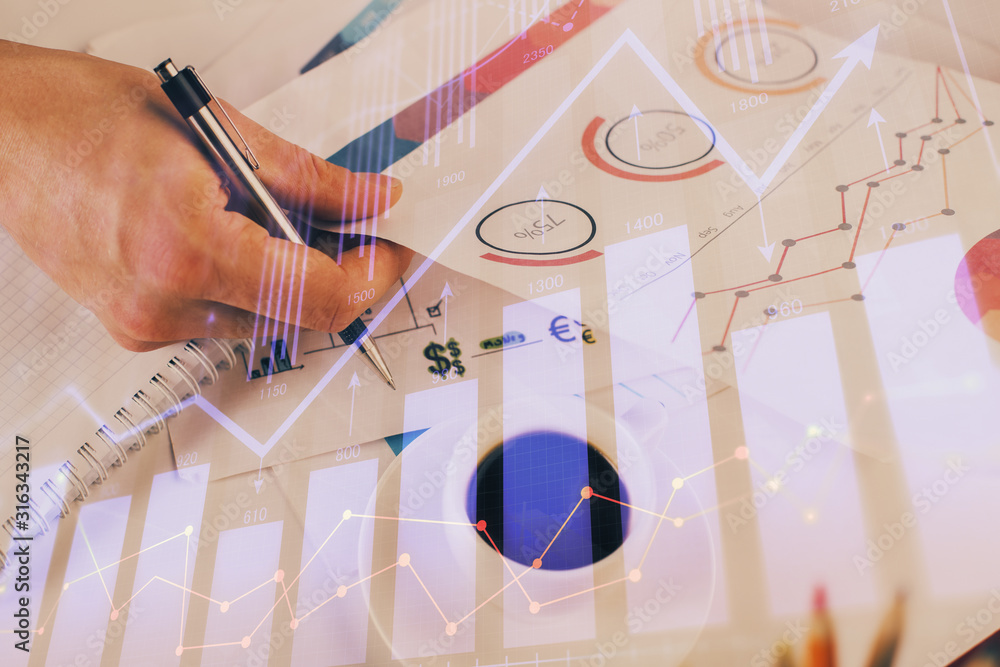 Multi exposure of man planing investment with stock market forex chart. Multi exposure of man planing investment with stock market forex chart.
