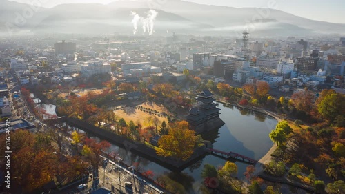 Aerial view Hyper lapse 4k Video of Matsumoto Castle on morning in Matsumoto city Nagano, Japan. photo