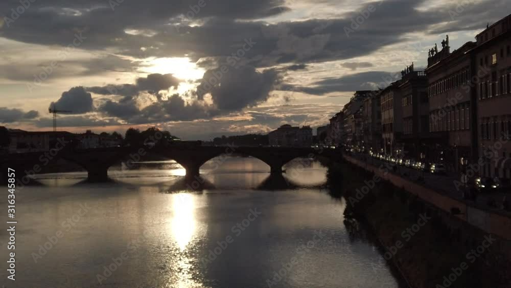 Ponte Vecchio, Florence, Italy. 05/2019 Famous bridge in Florence with small houses. Slow Motion. Ponte Vecchio, Florence, Italy. 05/2019 Famous bridge in Florence with small houses. Slow Motion.
