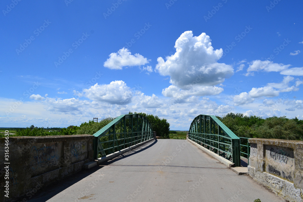 Beautiful clouds over the plain Bridge to Lukino Selo Beautiful clouds over the plain Bridge to Lukino Selo