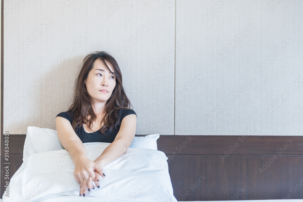 depress woman sitting on bed in room , sadness and depress concept depress woman sitting on bed in room , sadness and depress concept