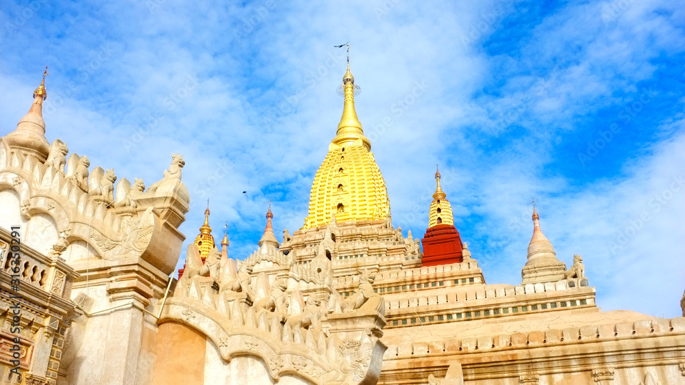 Fototapeta premium Myanmar, Bagan - December 17, 2018: Ananda Temple majestic view on a blue sky