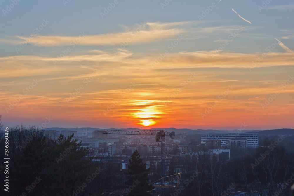 cityscape with the setting sun. Krakow at sunset. cityscape with the setting sun. Krakow at sunset.